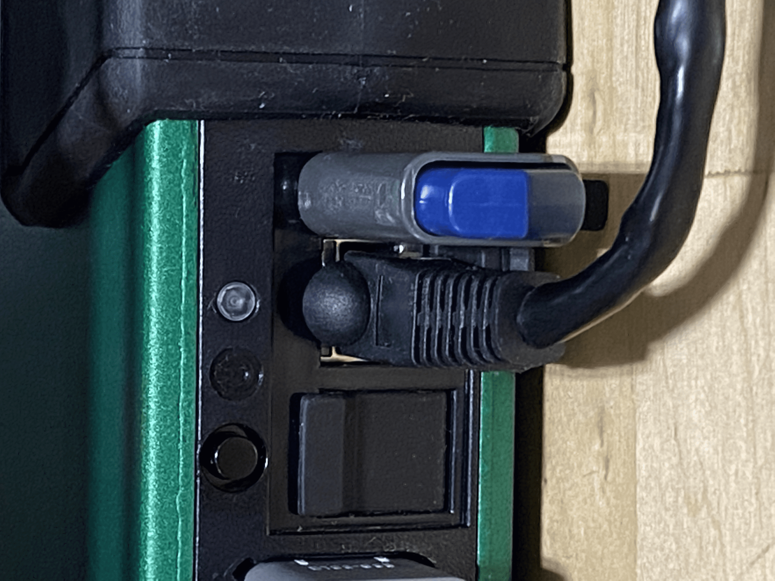 USB drive (top) inserted into port on DBM. Before inserting the drive, press the power button (black circle on left) and make sure that the LED is off.